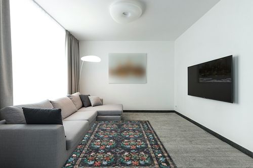 Loloi Rifle Paper Co. x Courtyard Charcoal 5'-0" x 7'-6" Area Rug in Modern Living Room with Grey Couch