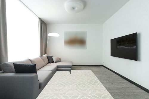 SAFAVIEH Adirondack Collection Area Rug - 6' x 9', Green & Ivory, Modern Diamond Distressed Design, Non-Shedding & Easy Care, Ideal for High Traffic Areas in Living Room, Bedroom (ADR131Y) in Modern Living Room with Grey Couch
