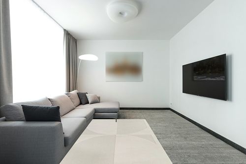 Mensa Cream Modern Geometric Area Rug Wade Logan Rug Size: Rectangle 5'3" x 7' in Modern Living Room with Grey Couch