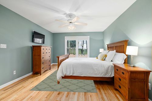 Garland Rug Quatro 6 ft. x 9 ft. Area Rug Sage in Teal and Orange Wood Bedroom