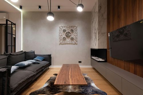 Sunshine Cowhides Genuine Dark Brindle Cowhide Rug - Luxurious Cow Rug for Bedroom, Living Room, and Home Decor Enthusiasts - Masterpiece of Style and Functionality - 6x6-7ft (180x210cm) in Dark Wood Living Room with Black Couch