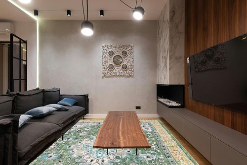 SAFAVIEH Madison Collection Area Rug - 9' x 12', Green & Turquoise, Boho Medallion Distressed Design, Non-Shedding & Easy Care, Ideal for High Traffic Areas in Living Room, Bedroom (MAD474Y) in Dark Wood Living Room with Black Couch