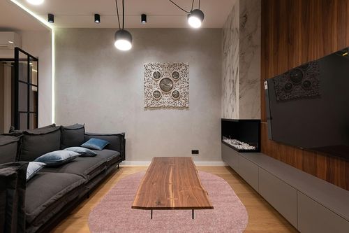 JONATHAN Y SEU100P-6OV Haze Solid Low-Pile Indoor Area Rug, Coastal, Bohemian, Minimalist, Classic, Casual for Bedroom,Kitchen,Living Room,Non Shedding,Easy-Washing, Pink, 6 X 9 Oval in Dark Wood Living Room with Black Couch
