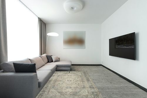 Magnolia Home by Joanna Gaines x Loloi Sinclair Collection SIN-04 Natural / Sage 5'-0" x 7'-0" Area Rug in Modern Living Room with Grey Couch
