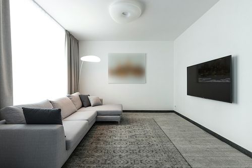 Mark&Day Wool Rugs, 6x9 Hello Traditional Black Area Rug, Ivory Cream Black Carpet for Living Room, Bedroom or Kitchen (6' x 9') in Modern Living Room with Grey Couch