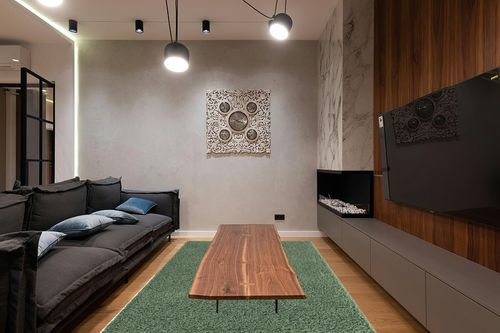 Green Shag Rug 6'x9' in Dark Wood Living Room with Black Couch