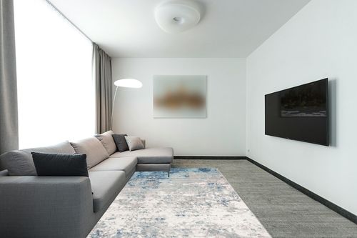 SAFAVIEH Brentwood Collection Area Rug - 6' x 9', Light Grey & Blue, Modern Abstract Design, Non-Shedding & Easy Care, Ideal for High Traffic Areas in Living Room, Bedroom (BNT822F) in Modern Living Room with Grey Couch