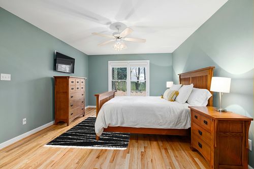 Abrahams Geometric Black/White Area Rug Hashtag Home Rug Size: Rectangle 5'3" x 8' in Teal and Orange Wood Bedroom