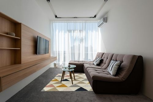Patao Geometric Ivory/Mustard/Taupe Area Rug Wade Logan Rug Size: Rectangle 5'3" x 7' in Grey Living Room with Brown Couch