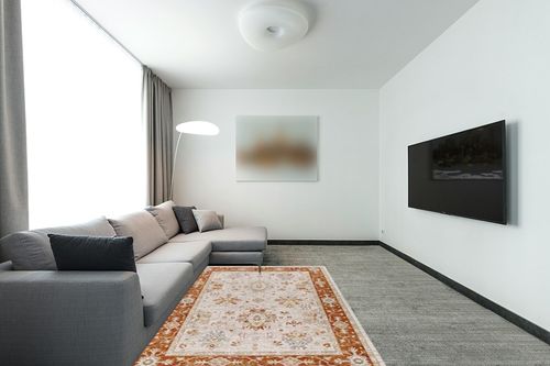 Mark&Day Area Rugs, 5x7 Cherry Valley Traditional Burnt Orange Area Rug, Burnt Orange Carpet for Living Room, Bedroom or Kitchen (5' x 7'5") in Modern Living Room with Grey Couch