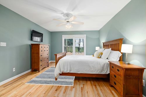 Dash and Albert Malta Wool Area Rug - 5' x 8' Blue - Coastal Charm Handwoven Wool Accent Rug - Durable, Lightweight, Easy to Clean in Teal and Orange Wood Bedroom