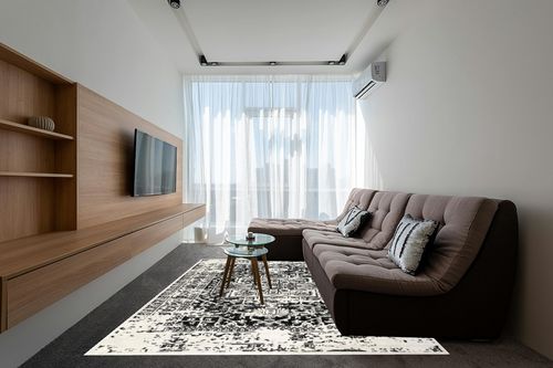 nuLOOM Jordana Vintage Distressed Medallion Area Rug, 8x10, Black and White in Grey Living Room with Brown Couch