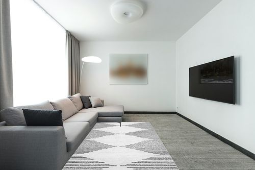 Washable Diamond Stripes Area Rug in Modern Living Room with Grey Couch