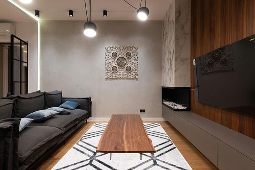 SAFAVIEH Adirondack Collection Area Rug - 6' x 9', Ivory & Charcoal, Modern Geometric Distressed Design, Non-Shedding & Easy Care, Ideal for High Traffic Areas in Living Room, Bedroom (ADR253B) in Dark Wood Living Room with Black Couch