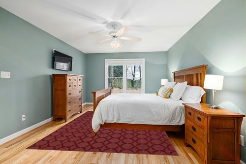 Garland Rug Sparta 8-Feet by 10-Feet Area Rug Chili Red in Teal and Orange Wood Bedroom