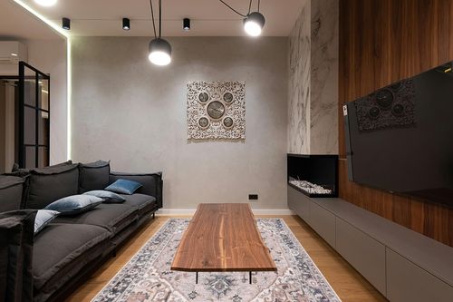 nuLOOM Sasha Machine Washable Medallion Area Rug, 6x9, Pink in Dark Wood Living Room with Black Couch