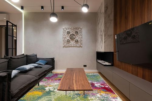 SAFAVIEH Watercolor Collection Area Rug - 9' x 12', Green & Fuchsia, Colorful Boho Abstract Design, Non-Shedding & Easy Care, Ideal for High Traffic Areas in Living Room, Bedroom (WTC697C) in Dark Wood Living Room with Black Couch