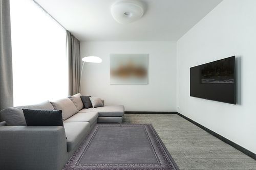Antep Rugs Alfombras Bordered Modern 5x7 Non-Slip (Non-Skid) Low Pile Rubber Backing Indoor Area Rug (Gray, 5' x 7') in Modern Living Room with Grey Couch