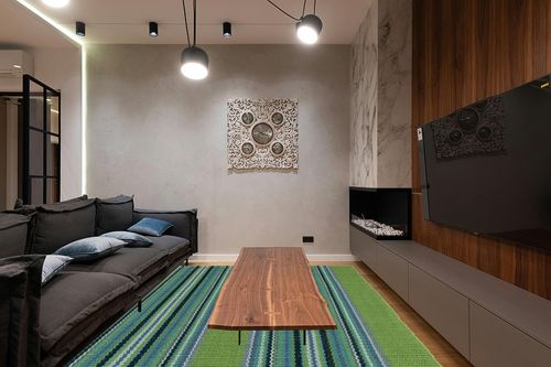 Dash and Albert Green Handwoven Indoor/Outdoor Rug, 9 X 12 Feet, Green/Blue Stripe Pattern in Dark Wood Living Room with Black Couch
