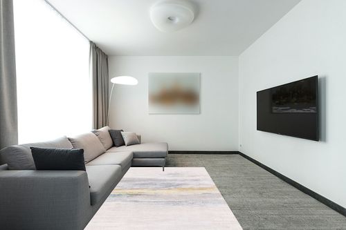 FINOREN Abstract Vignetting Area Rugs for Living Room,Bedroom,Hallway,Dining Room,Non-Shedding,Non Slip Backing,Floor Decoration Carpets,Gray-Golden,5x7 Feet in Modern Living Room with Grey Couch