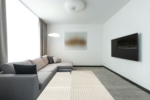 Abani Nuevo Collection Area Rug - Modern Arch Beige/Cream Pattern - 6'x9' - Easy to Clean - Durable for Kids & Pets - Non-Shedding - Medium Pile - Soft Feel - for Living Room, Bedroom & Office in Modern Living Room with Grey Couch