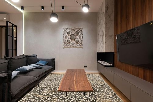 Liora Manne Soho Leopard Indoor Rug Black 7'10"X9'10" in Dark Wood Living Room with Black Couch