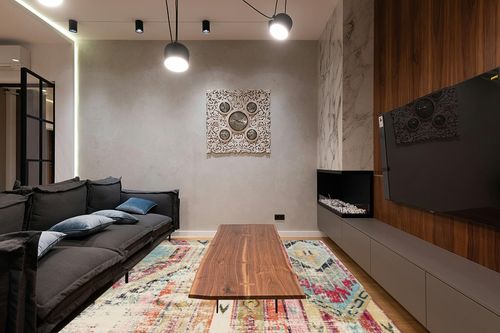 SAFAVIEH Monaco Collection Area Rug - 8' x 10', Multi, Boho Chic Tribal Distressed Design, Non-Shedding & Easy Care, Ideal for High Traffic Areas in Living Room, Bedroom (MNC222F) in Dark Wood Living Room with Black Couch