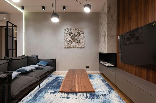 LUXE WEAVERS Kingsbury Abstract Premium 8x10 Area Rug 7773 in Dark Wood Living Room with Black Couch
