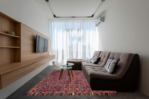 SAFAVIEH Blossom Collection 8' x 10' Purple / Multi BLM451A Handmade Tassel Premium Wool Area Rug in Grey Living Room with Brown Couch