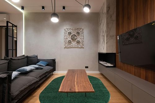 JONATHAN Y SEU100L-6OV Haze Solid Low-Pile Indoor Area Rug, Coastal, Bohemian, Minimalist, Classic, Casual for Bedroom,Kitchen,Living Room,Non Shedding,Easy-Washing, Green, 6 X 9 Oval in Dark Wood Living Room with Black Couch