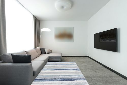 LUXE WEAVERS Tower Hill Abstract Blue 5x7 Area Rug in Modern Living Room with Grey Couch