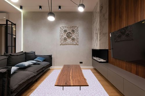 Safavieh Faux Hide Collection Area Rug - 6' x 9', Ivory & Pink, Leopard Rustic Design, Non-Shedding & Easy Care, Machine Washable Ideal for High Traffic Areas in Living Room, Bedroom (FAH505B) in Dark Wood Living Room with Black Couch