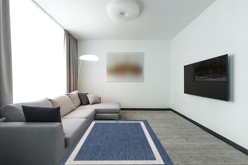 Akeira Power Loom Blue Rug Ebern Designs Rug Size Rectangle 5' x 7' in Modern Living Room with Grey Couch