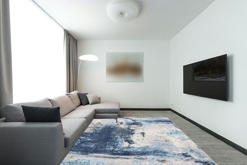 LUXE WEAVERS Kingsbury Abstract Premium 8x10 Area Rug 7773 in Modern Living Room with Grey Couch