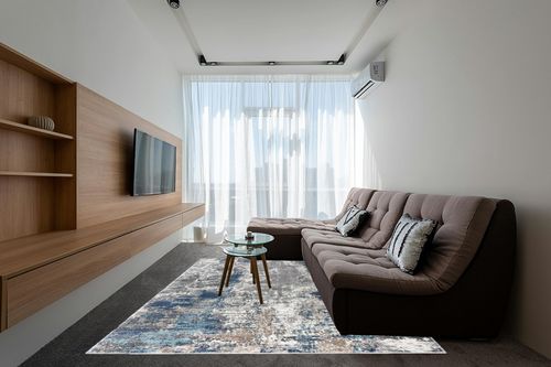 LUXE WEAVERS Euston Collection 7679 Blue 8x10 Abstract Area Rug in Grey Living Room with Brown Couch