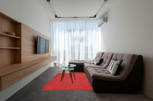 Garland Rug Skyline Shag 5 Ft. x 7 Ft. Area Rug Chili Red in Grey Living Room with Brown Couch