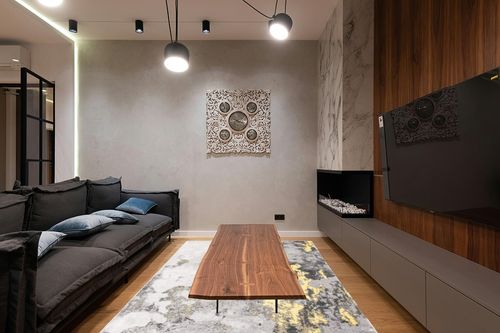 SAFAVIEH Adirondack Collection Area Rug - 6' x 9', Grey & Yellow, Modern Abstract Design, Non-Shedding & Easy Care, Ideal for High Traffic Areas in Living Room, Bedroom (ADR134H) in Dark Wood Living Room with Black Couch