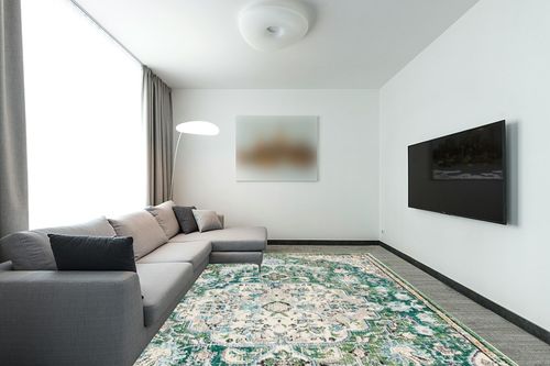 SAFAVIEH Madison Collection Area Rug - 9' x 12', Green & Turquoise, Boho Chic Medallion Distressed Design, Non-Shedding & Easy Care, Ideal for High Traffic Areas in Living Room, Bedroom (MAD447Y) in Modern Living Room with Grey Couch