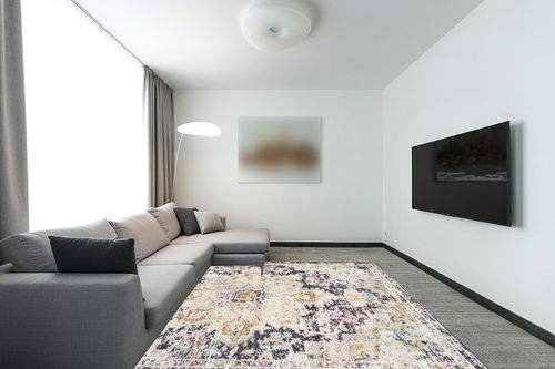 SAFAVIEH Madison Collection Area Rug - 8' x 10', Black & Gold, Boho Chic Medallion Distressed Design, Non-Shedding & Easy Care, Ideal for High Traffic Areas in Living Room, Bedroom (MAD473Z) in Modern Living Room with Grey Couch