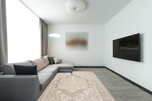 SAFAVIEH Reflection Collection Area Rug - 6' x 9', Beige & Cream, Vintage Distressed Design, Non-Shedding & Easy Care, Ideal for High Traffic Areas in Living Room, Bedroom (RFT664A) in Modern Living Room with Grey Couch