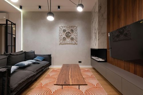 COZYLOOM Area Rug 6x9 Rugs for Living Room Modern Rug Ultra-Soft Abstract Low Pile Carpet Non-Slip Non-Shedding Bedroom Rug Indoor Foldable Thin Rug for Dining Room Nursery Kids Room Office Orange in Dark Wood Living Room with Black Couch