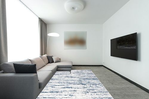 SAFAVIEH Amelia Collection Area Rug - 6' x 9', Grey & Navy, Modern Abstract Design, Non-Shedding & Easy Care, Ideal for High Traffic Areas in Living Room, Bedroom (ALA768B) in Modern Living Room with Grey Couch