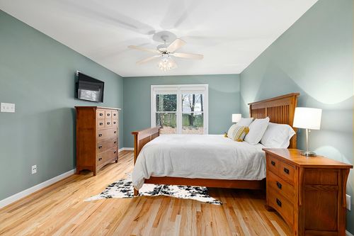 nuLOOM Marcia Machine Washable Faux Cowhide Area Rug, 5' x 6' 7", Black in Teal and Orange Wood Bedroom