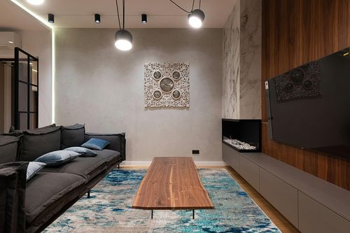 SAFAVIEH Madison Collection Area Rug - 9' x 12', Blue & Grey, Modern Boho Abstract Design, Non-Shedding & Easy Care, Ideal for High Traffic Areas in Living Room, Bedroom (MAD440M) in Dark Wood Living Room with Black Couch