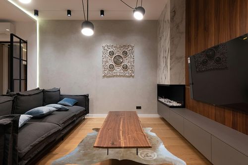 Genuine Palomino White and Beige Cowhide Rug 6 x 7-8 ft. 180 x 240 cm in Dark Wood Living Room with Black Couch