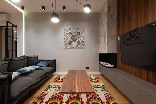 SAFAVIEH Ikat Collection Area Rug - 6' x 9', Beige & Yellow, Handmade Wool, Ideal for High Traffic Areas in Living Room, Bedroom (IKT464A) in Dark Wood Living Room with Black Couch