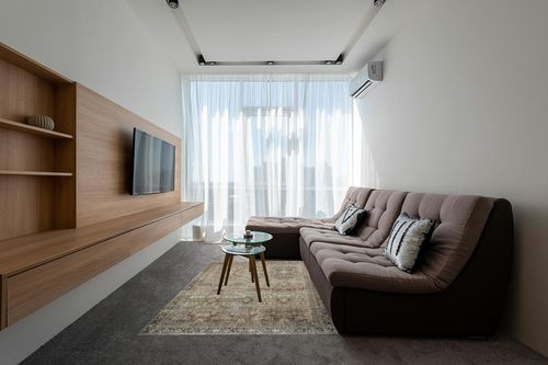 Loloi II Layla Collection LAY-03 Traditional Olive/Charcoal 5'-0" x 7'-6" Area Rug in Grey Living Room with Brown Couch