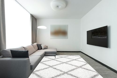 nuLOOM Tess Moroccan Shag Area Rug, 8x10, White in Modern Living Room with Grey Couch