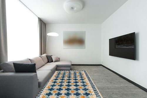 SAFAVIEH Aspen Collection Area Rug - 5' x 8', Navy & Yellow, Handmade Boho Wool, Ideal for High Traffic Areas in Living Room, Bedroom (APN121N) in Modern Living Room with Grey Couch