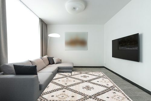SAFAVIEH Kilim Collection Area Rug - 8' x 10', Ivory & Black, Handmade Flat Weave Jute, Ideal for High Traffic Areas in Living Room, Bedroom (KLM761A) in Modern Living Room with Grey Couch